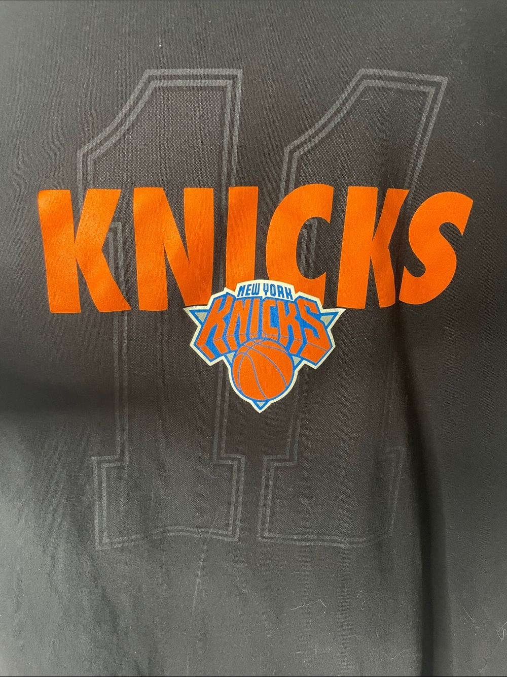 New York Knicks Brunson Black Tee with Orange Graphic